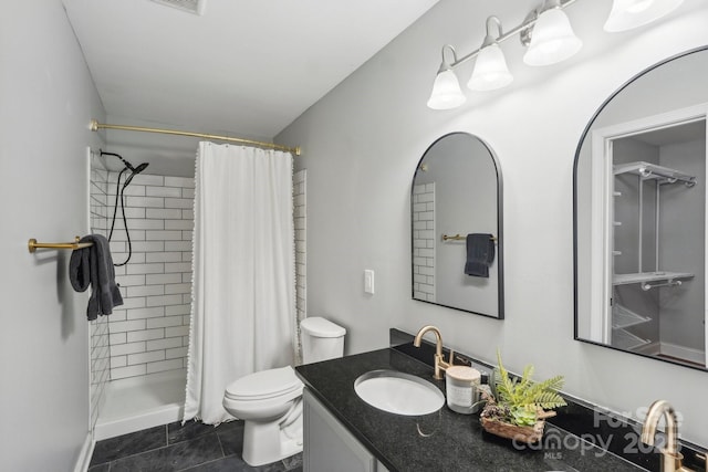 full bath featuring vanity, tile patterned flooring, a shower stall, and toilet