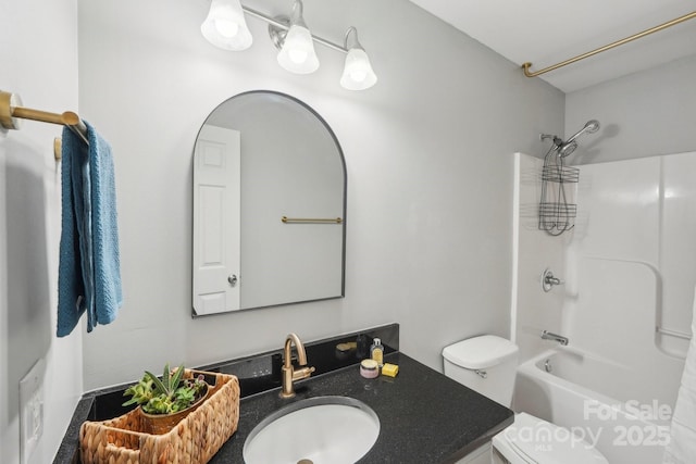 bathroom with toilet, washtub / shower combination, and vanity