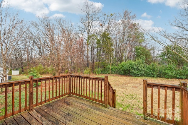 deck with an outbuilding and a yard