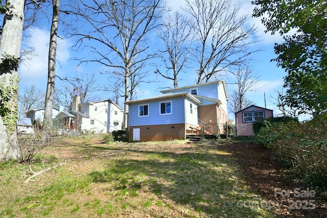 exterior space with crawl space and a wooden deck