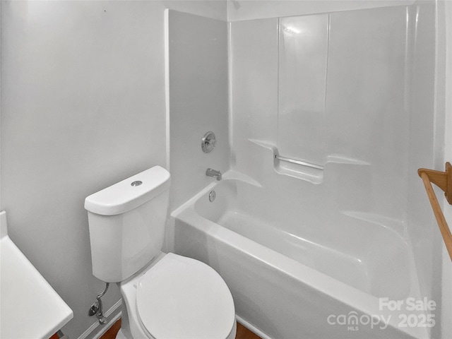 full bathroom with bathtub / shower combination and toilet