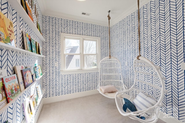 bathroom with visible vents, crown molding, and wallpapered walls