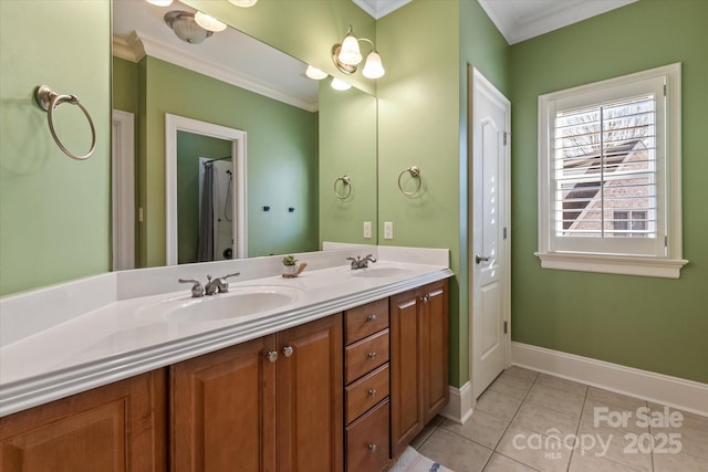 bathroom with a sink, baseboards, tile patterned floors, double vanity, and crown molding