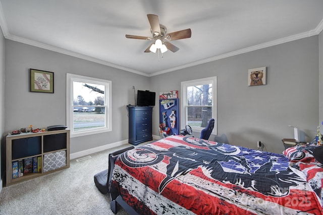 carpeted bedroom featuring visible vents, baseboards, a ceiling fan, and ornamental molding