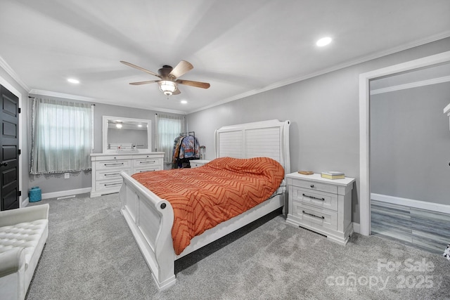 bedroom featuring multiple windows, baseboards, crown molding, and light colored carpet