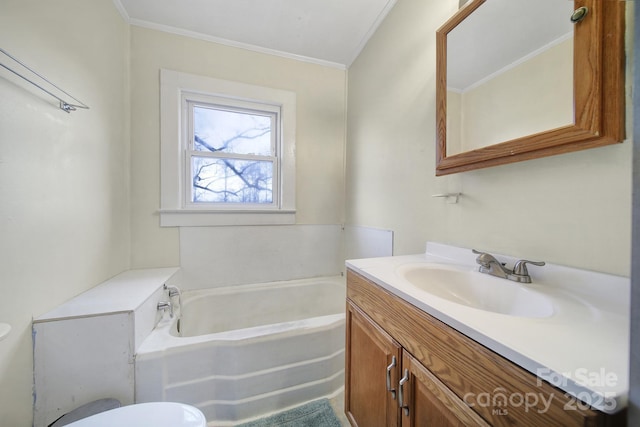 full bath featuring a garden tub, crown molding, vanity, and toilet