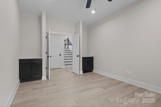 unfurnished room with light wood-style floors, recessed lighting, baseboards, and a ceiling fan