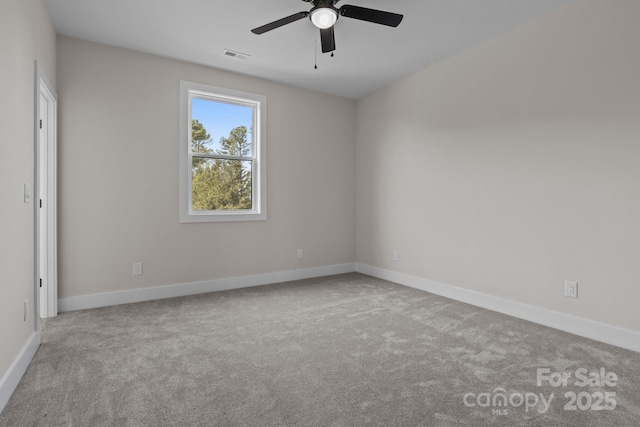 unfurnished room featuring visible vents, baseboards, and light colored carpet