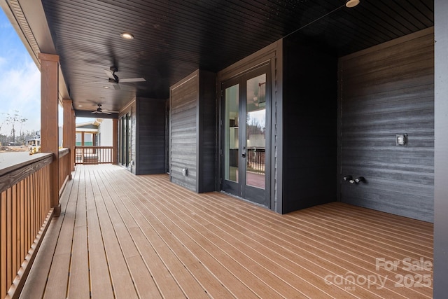 wooden terrace with french doors and ceiling fan