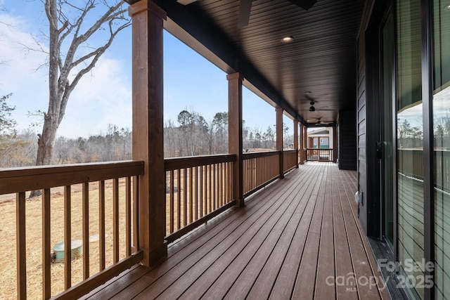 wooden deck with ceiling fan