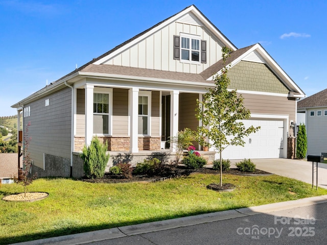 view of front of property featuring driveway, a porch, board and batten siding, and a front yard