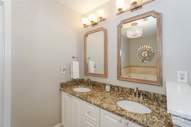 bathroom with double vanity and a sink