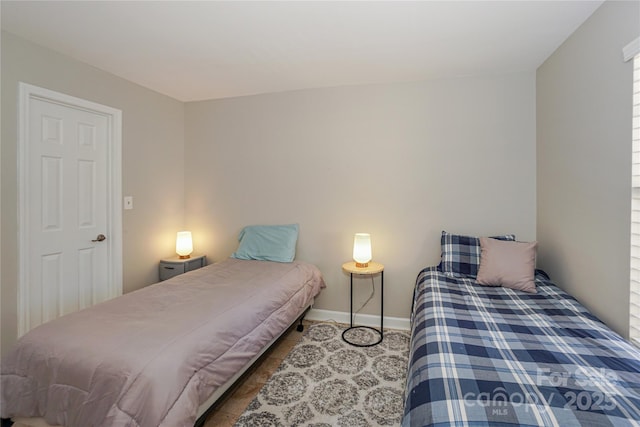 bedroom featuring baseboards