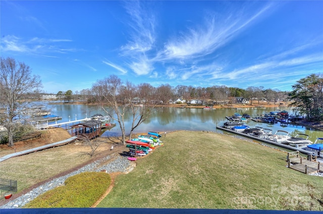 exterior space with a water view and a yard