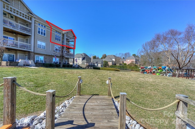 dock area featuring a lawn