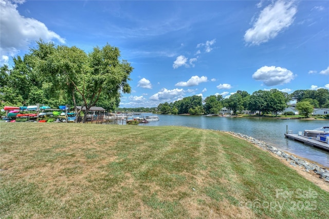 exterior space with a water view and a boat dock