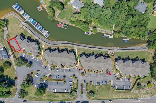 aerial view with a water view and a residential view