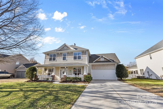 view of front of home featuring a porch, a front yard, a garage, and concrete driveway