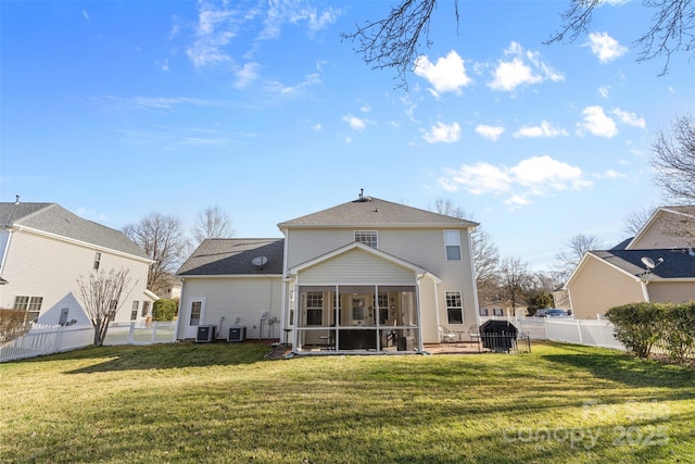 rear view of house with a fenced backyard, central air condition unit, a yard, and a sunroom