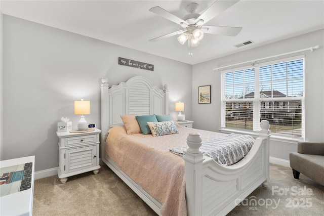 bedroom with visible vents, a ceiling fan, baseboards, and carpet floors