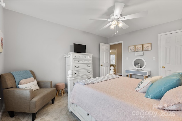 bedroom featuring a ceiling fan and light carpet