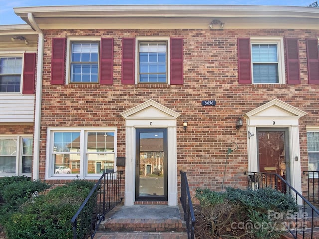 view of front of home with brick siding