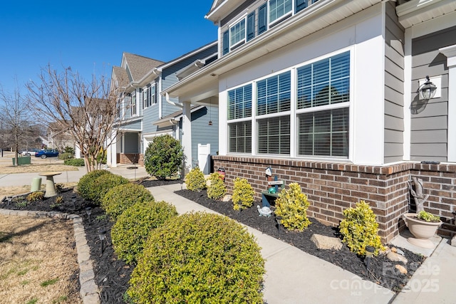 126 W Morehouse Ave, Mooresville, NC 28117 - view of home's exterior with brick siding