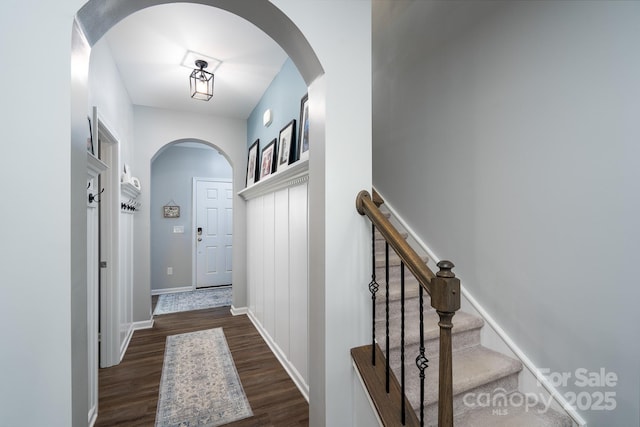 126 W Morehouse Ave, Mooresville, NC 28117 - interior space featuring arched walkways, baseboards, stairs, and dark wood finished floors