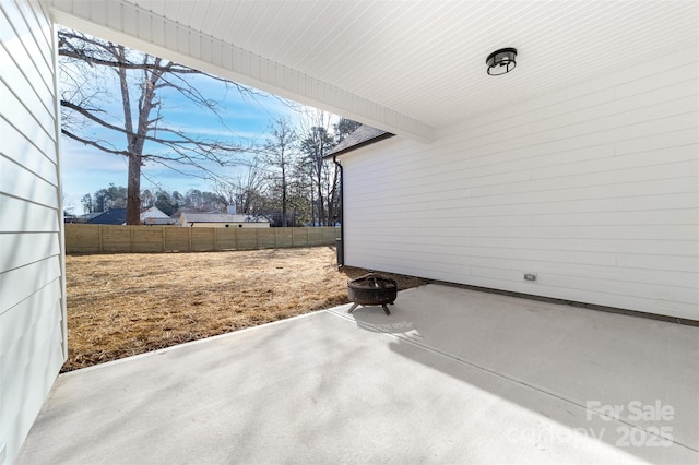 view of patio featuring fence