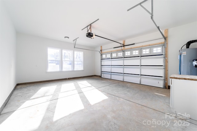 garage featuring a garage door opener, electric water heater, and baseboards