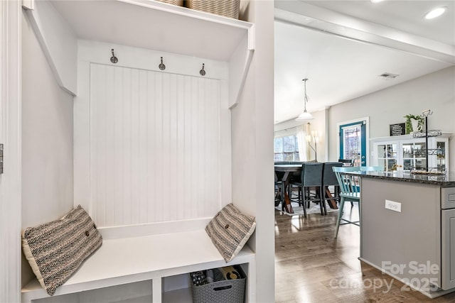 mudroom with recessed lighting, visible vents, and wood finished floors