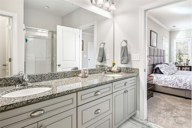 ensuite bathroom with ornamental molding, a sink, and ensuite bathroom