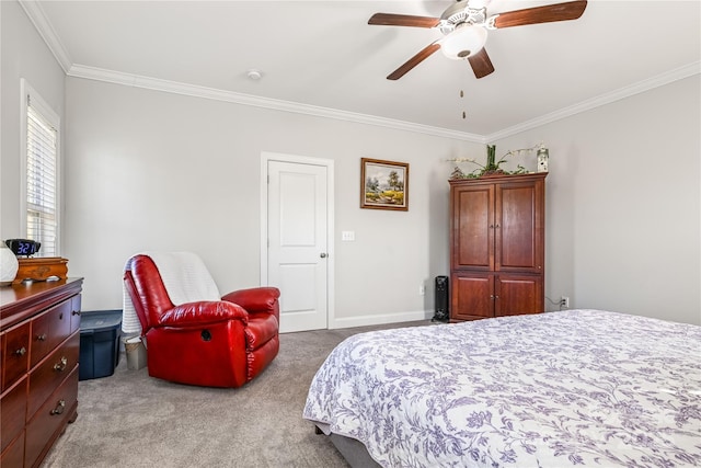 bedroom featuring carpet floors, ceiling fan, baseboards, and crown molding