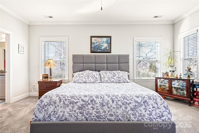 bedroom featuring light colored carpet, crown molding, and visible vents