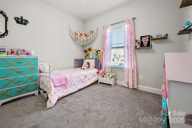 carpeted bedroom with baseboards