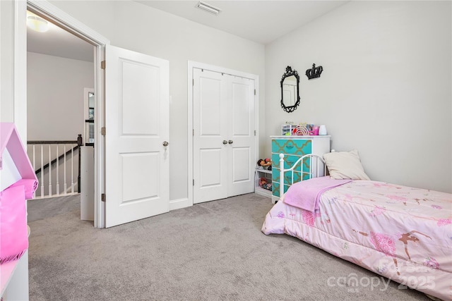 bedroom featuring a closet, carpet flooring, and visible vents