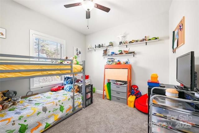 bedroom with carpet floors, ceiling fan, and multiple windows