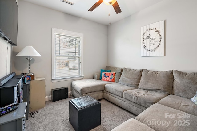 carpeted living area featuring ceiling fan and visible vents