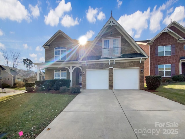 view of front of house with driveway, stone siding, a garage, and a front lawn