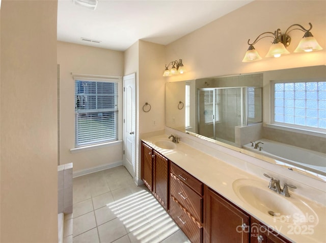 bathroom featuring a sink, visible vents, a shower stall, tile patterned floors, and double vanity