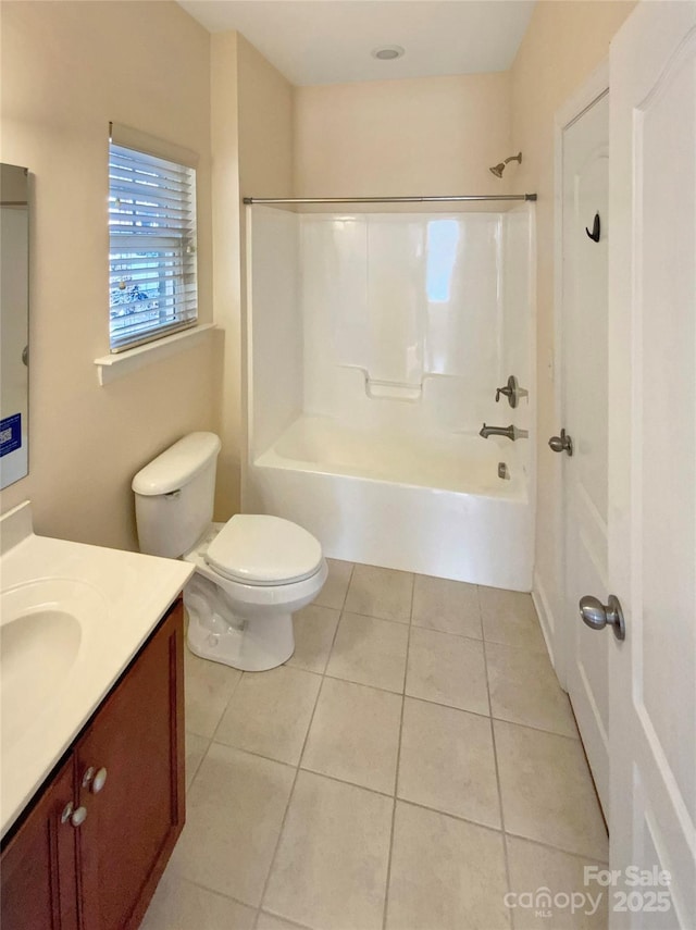 bathroom with toilet, tile patterned floors, washtub / shower combination, and vanity