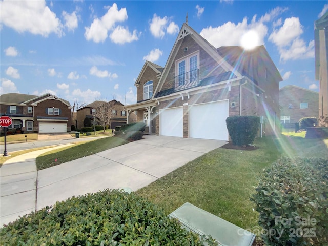 view of property exterior with an attached garage, brick siding, concrete driveway, a lawn, and a residential view