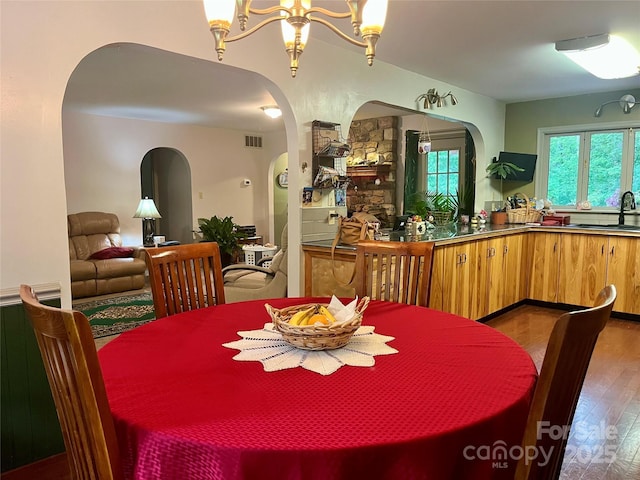1496 Givens St, Hickory, NC 28602 - dining area with arched walkways and wood-type flooring