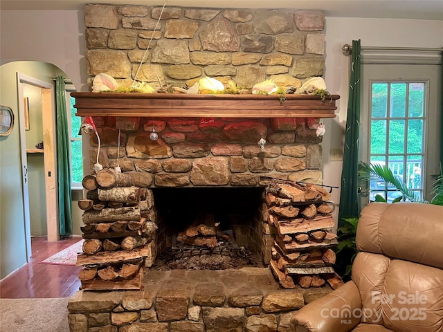 1496 Givens St, Hickory, NC 28602 - detailed view of a stone fireplace, wood finished floors, and arched walkways