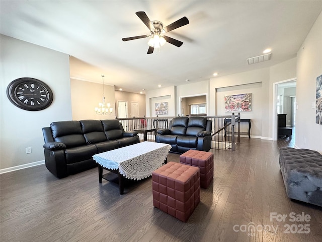 living room featuring recessed lighting, a notable chandelier, visible vents, baseboards, and dark wood-style floors