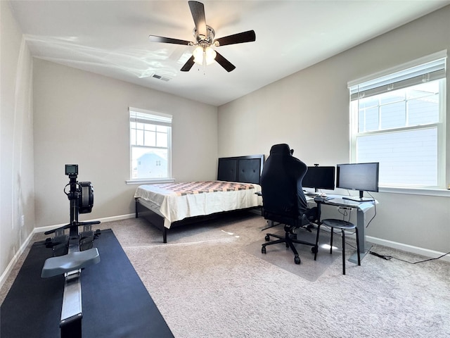 bedroom featuring a ceiling fan, carpet flooring, visible vents, and baseboards