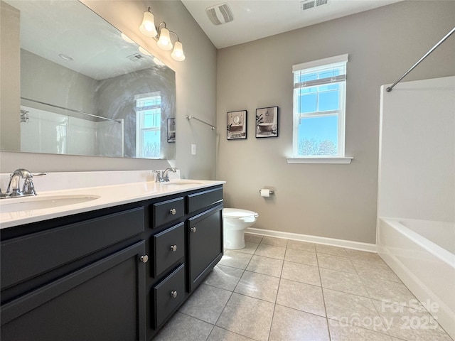 full bathroom featuring plenty of natural light, a sink, and toilet