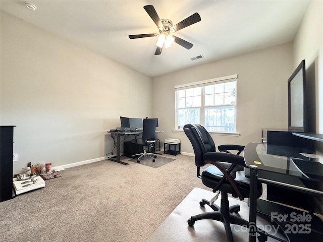 office featuring carpet, visible vents, ceiling fan, and baseboards