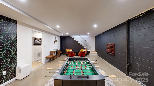 rec room with finished concrete floors, visible vents, and recessed lighting