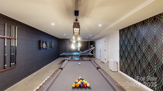 rec room featuring an accent wall, pool table, concrete floors, and recessed lighting